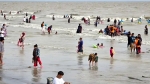 পূজার ছুটিতে কুয়াকাটা সৈকতে উচ্ছ্বসিত পর্যটক